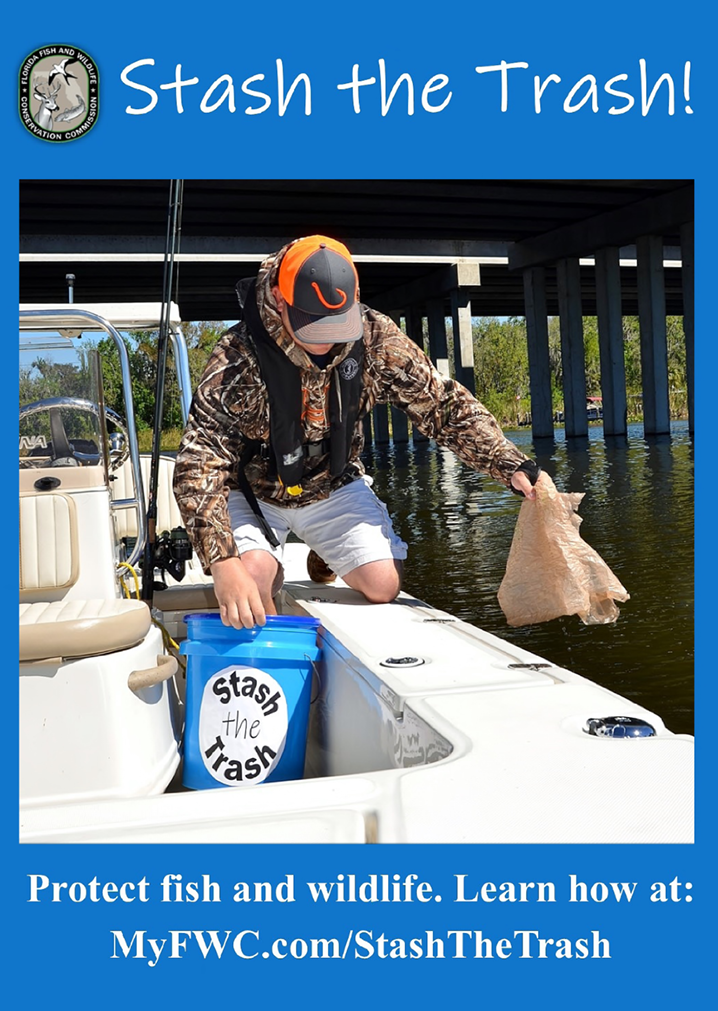 Boater placing trash into a blue “Stash the Trash” container on a fishing boat to promote clean waterways and protect fish and wildlife.