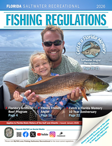 Cover of the 2026 Florida Saltwater Recreational Fishing Regulations featuring an adult and child smiling while holding a redfish on a boat.