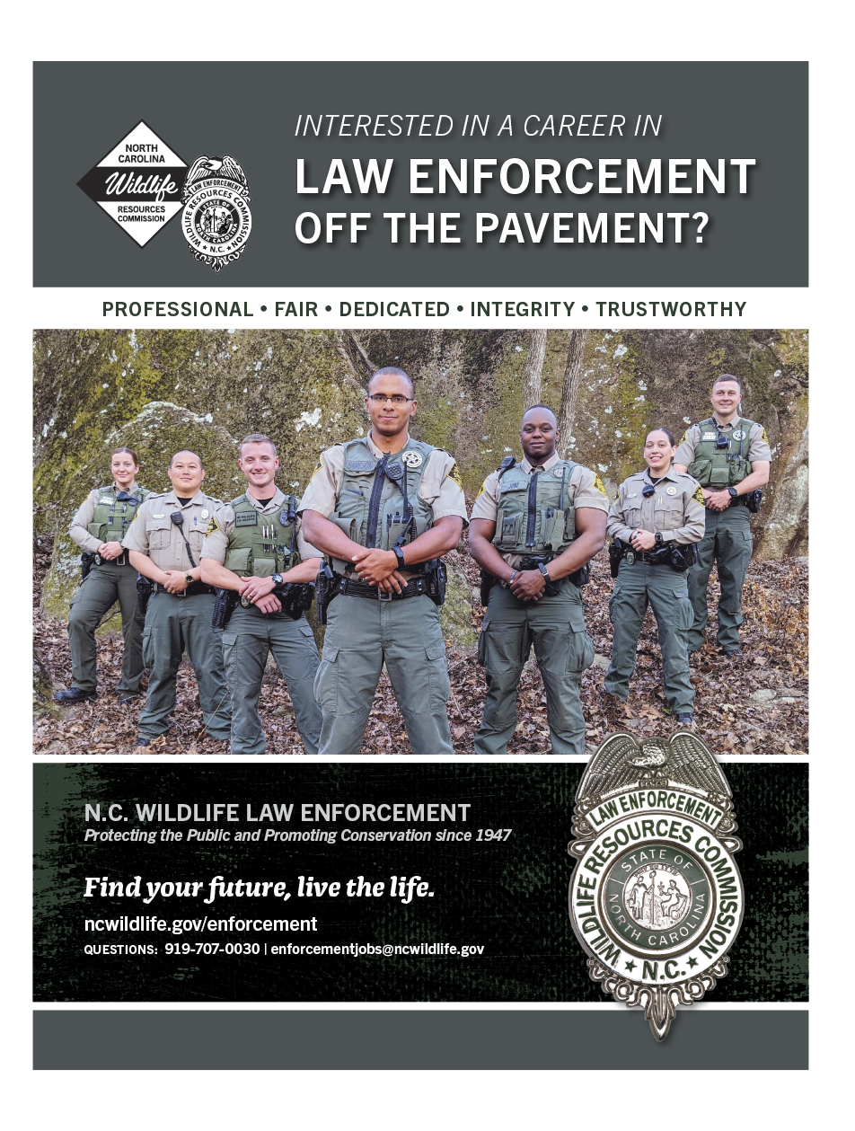 Recruitment poster for the North Carolina Wildlife Law Enforcement Division featuring uniformed officers standing outdoors. The image promotes a career in wildlife law enforcement with the message “Interested in a career in law enforcement off the pavement?” and emphasizes values such as professionalism, fairness, dedication, integrity, and trustworthiness. Contact information and a web address for applications are provided.