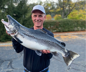 Joe Satkowski of Hampton with his state record Landlocked Salmon. Photo by Ron DeGraff.
