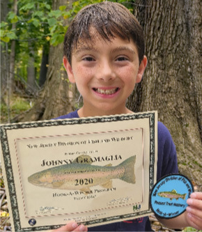 Johnny Gramaglia with his Hook-A-Winner rainbow trout, certificate and patch.