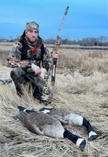 Hunter with canada geese